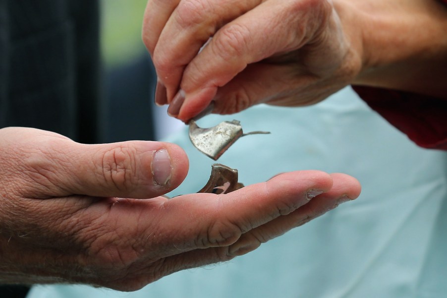 Rep. Jan Schakowsky (D-IL) and Rep. Frank Pallone (D-NJ) hold pieces of metal shrapnel from a defective Takata airbag during a news conference outside the U.S. Capitol on June 2, 2015, in Washington, D.C.