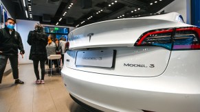 A white Tesla Model 3 on display