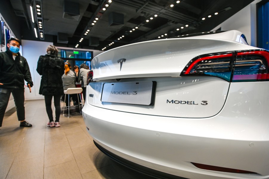 A white Tesla Model 3 on display