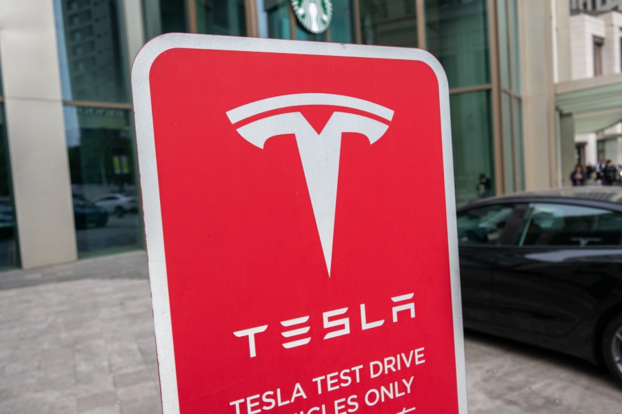 A Tesla electric vehicle test drive sign