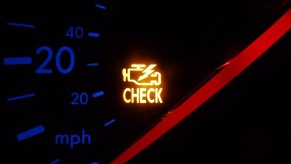 A check engine light on a VW instrument panel