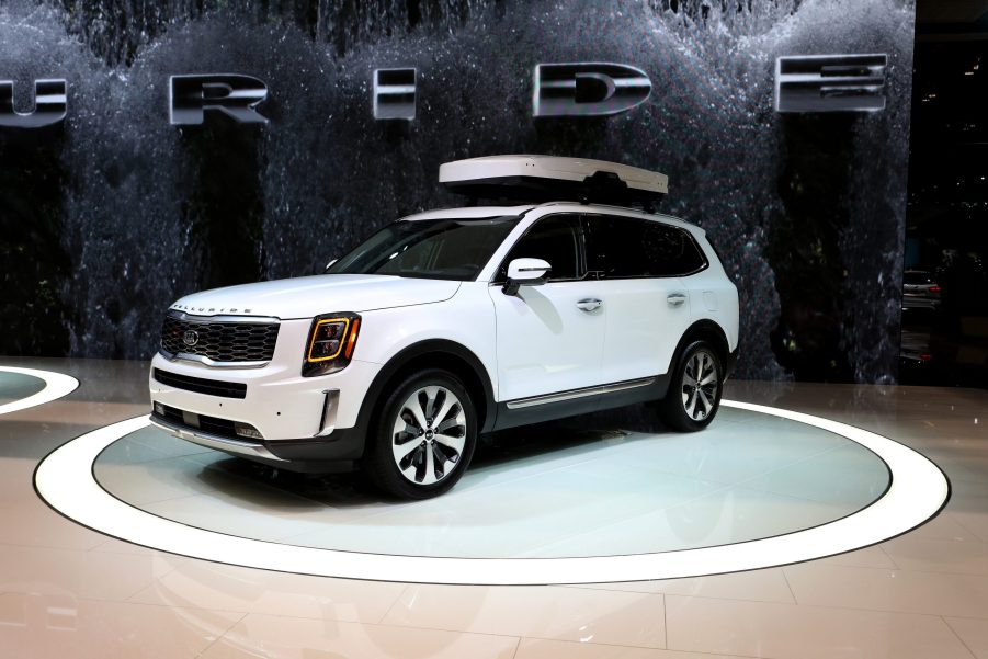 A white kia telluride side profile