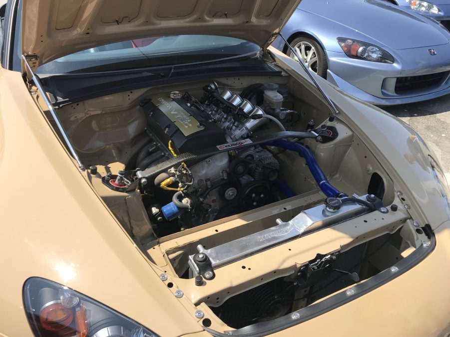 A wire-tucked engine bay in a Honda S2000