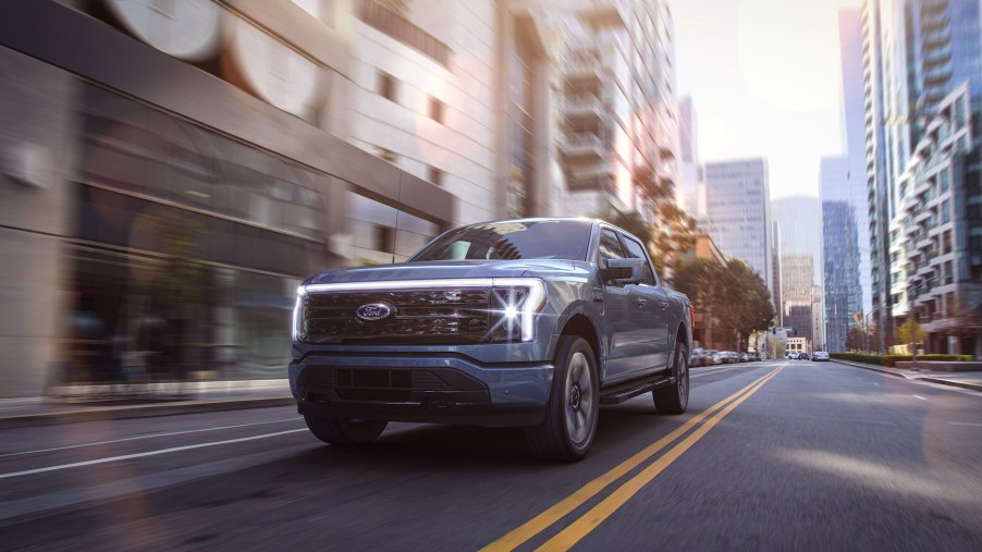 An image of a 2022 Ford F-150 Lightning parked outdoors.