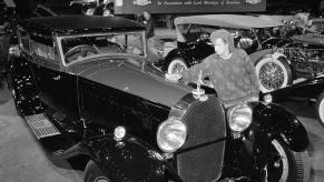 A man gives a 1931 Bugatti Royale Kellner Coupe a final polish at London's Royal Albert Hall before a Christie's auction