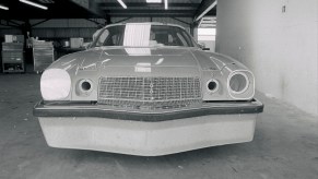 A black-and-white photo of Penske/Donohue's 1974 Chevrolet Camaro IROC race car