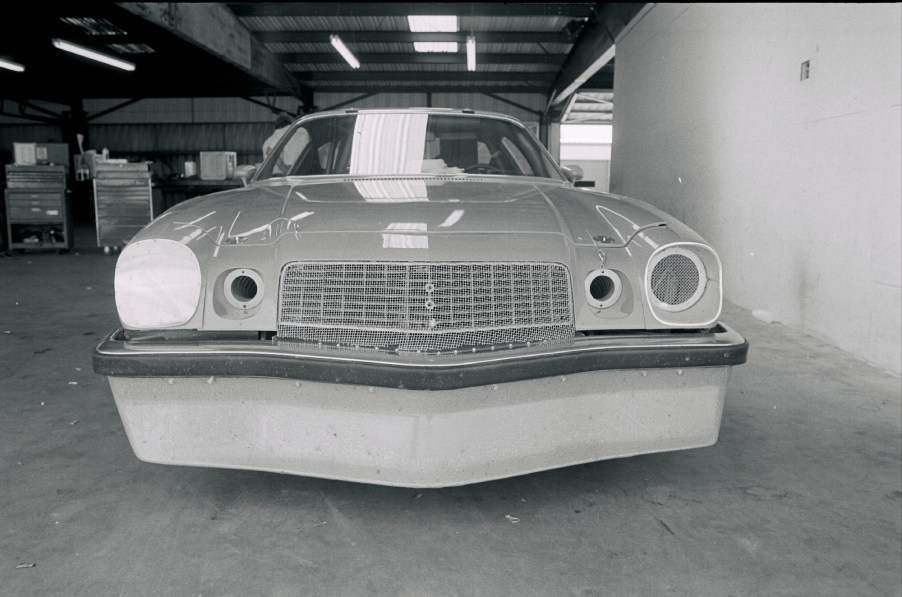 A black-and-white photo of Penske/Donohue's 1974 Chevrolet Camaro IROC race car