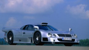 A silver 1999 Mercedes CLK GTR on a racetrack