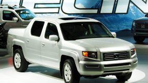 A silver 2006 Honda Ridgeline pickup truck on display