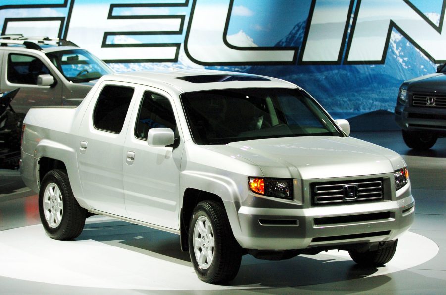 A silver 2006 Honda Ridgeline pickup truck on display