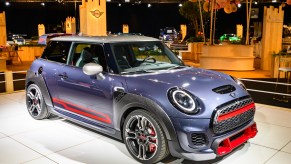 A blue and red 2020 Mini Cooper John Cooper Works subcompact car on display at Brussels Expo on January 9, 2020, in Brussels, Belgium