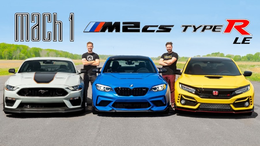 A gray-black-and-orange 2021 Ford Mustang Mach 1 next to a blue 2021 BMW M2 CS next to a yellow 2021 Honda Civic Type R Limited Edition on the Throttle House track