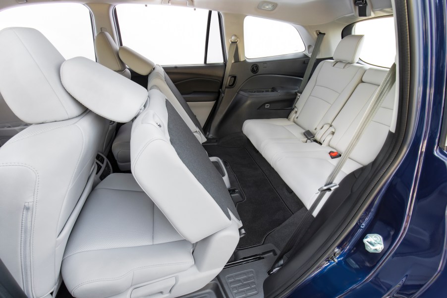 White-leather seating inside a 2021 Honda Pilot midsize SUV