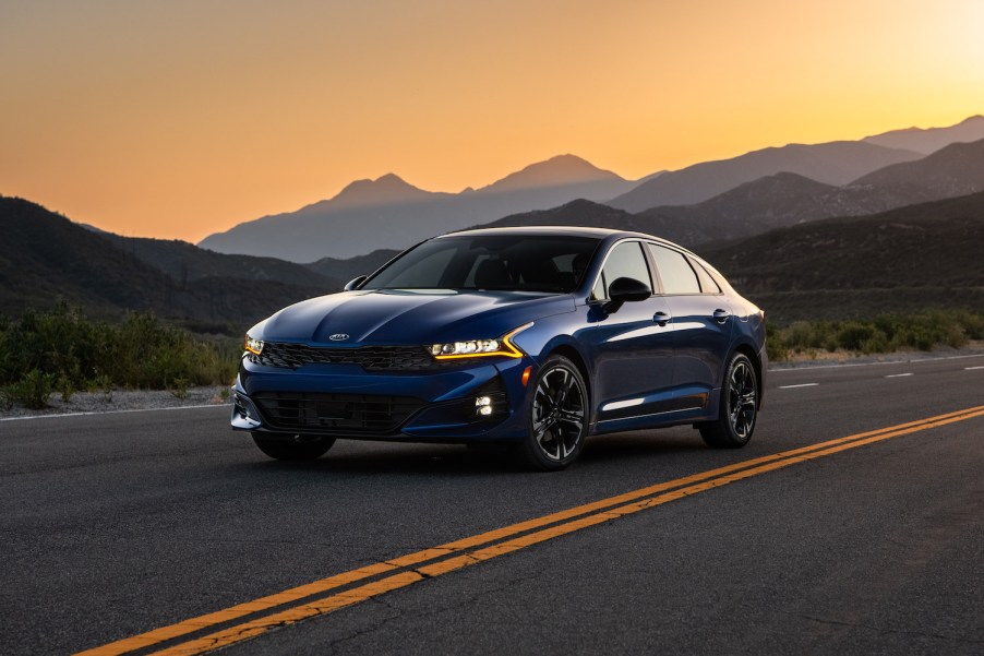 A blue 2021 K5 GT-Line 1.6T FWD at sunset