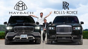 A black 2021 Mercedes-Maybach GLS 600 next to a black 2020 Rolls-Royce Cullinan Black Badge