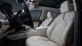 Side view of a 2021 Toyota Camry's front seats and steering wheel