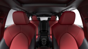 Red and black seating inside a 2021 Toyota Highlander XSE midsize three-row SUV