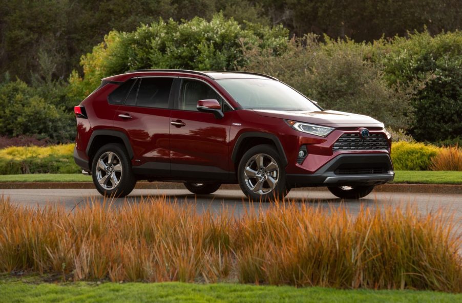 A ruby red 2021 Toyota RAV4 Hybrid