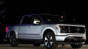 A 2022 Ford F-150 Lightning electric pickup truck parked outside Ford's headquarters in Michigan in May 2021