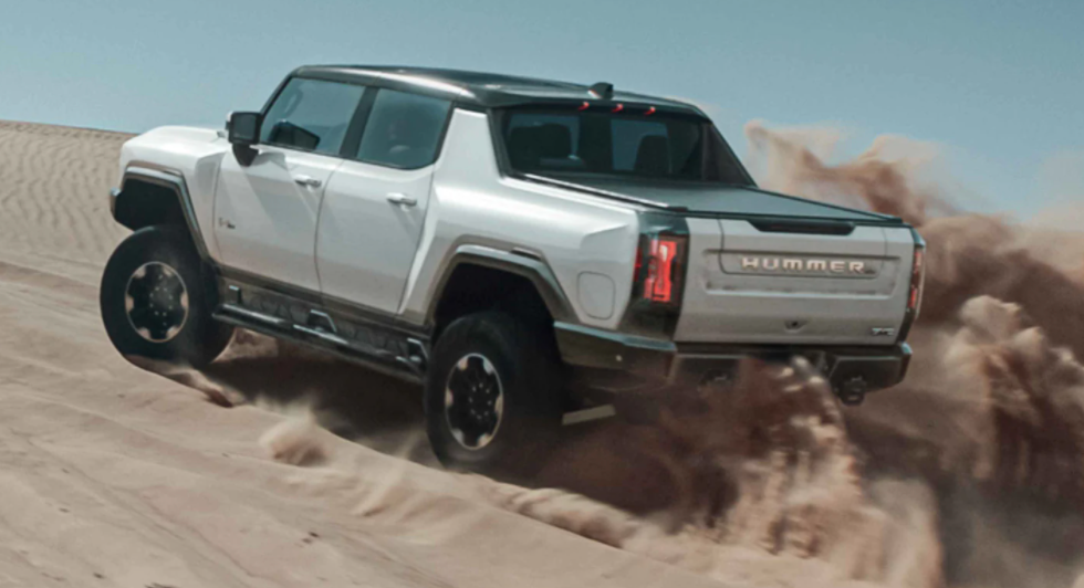 2022 GMC Hummer kicking up sand at the dunes