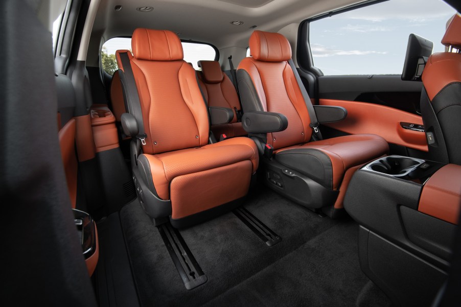 A 2022 Kia Carnival MPV's dark-gray and burnt-orange leather seating