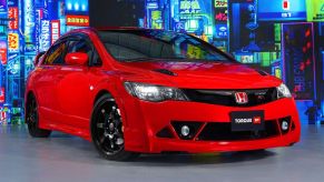 An image of a red Honda Civic Mugen RR in a dealership.