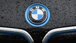 A BMW logo on the hood of a black car on March 15, 2021, in Munich, Germany