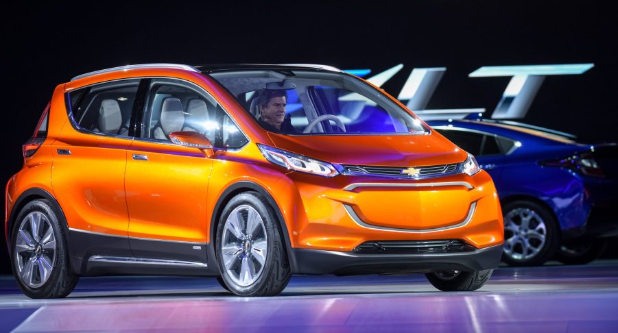 orange Chevy Bolt on stage