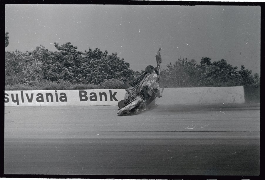 Dale Earnhardt's NASCAR car flips at Pocono Raceway.