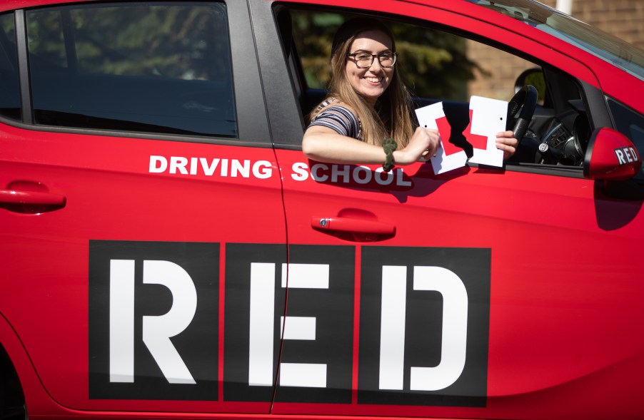 Jade Bone, 24, celebrates passing her driving test at a test centre in Southampton, Hampshire, where examinations have resumed under the latest easing of lockdown restrictions