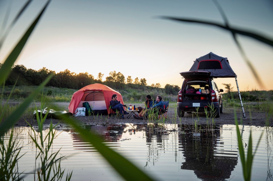 A family camping in a 2021 Ford Bronco Sport, one of the best SUVs for camping.