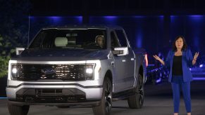 Linda Zhang, Chief Engineer, speaks at the reveal of the new all-electric Ford F-150 Lightning pickup truck in silver at Ford World Headquarters