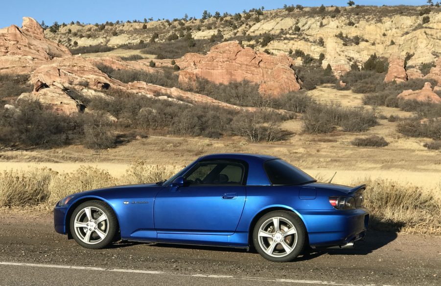 A side view of a Honda S2000 in the desert