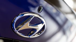 The Hyundai Motor Co. logo is displayed on the trunk of a blue Avante N Line sedan at the company's Motorstudio showroom in Seoul, South Korea