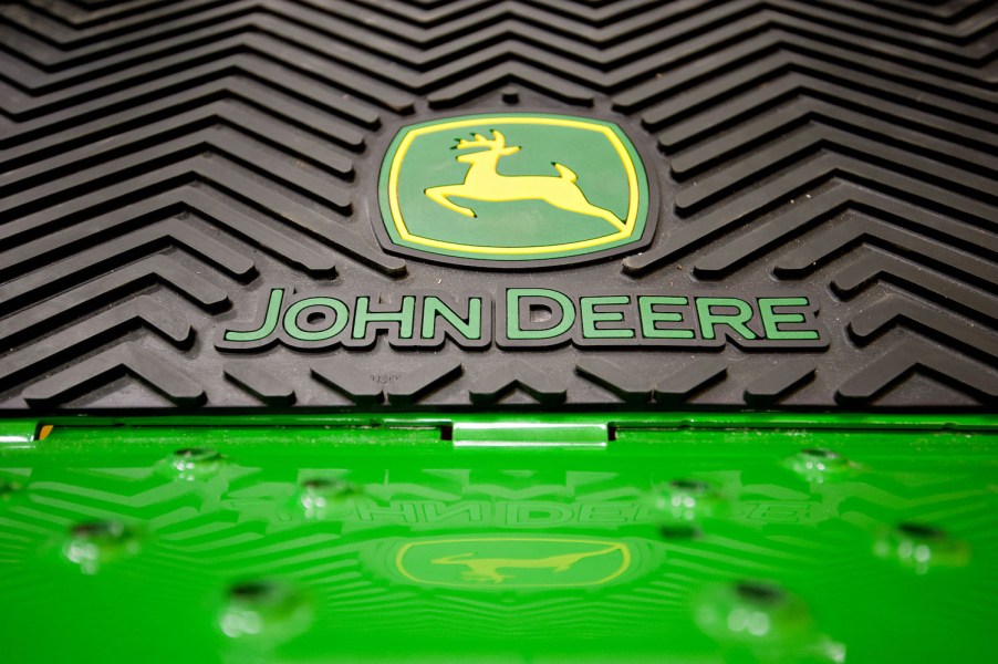 The John Deere logo on a riding lawn mower