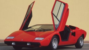 An image of a red Lamborghini Countach LP400 parked outdoors.