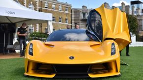 A fully electric yellow Lotus Evija hypercar is displayed during the London Concours at Honourable Artillery Company