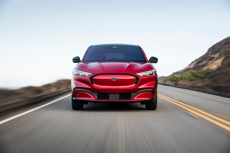 A red 2021 Ford Mustang Mach-E driving