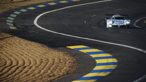 The Nissan R390 GT1 race car on a paved road