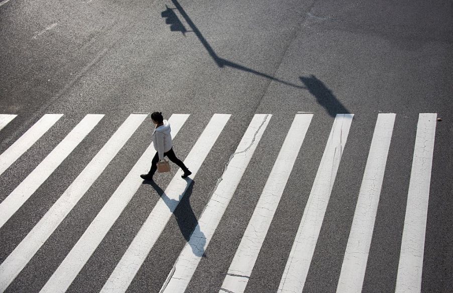 lone pedestrian in crosswalk