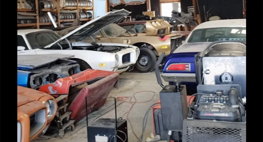 a garage full of vintage Pontiac Firebird barn finds