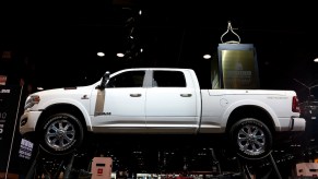 A white Ram 1500 on display at an auto show