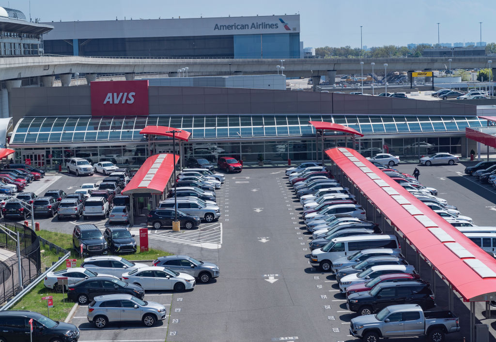 A lot of rental cars at an airport