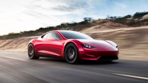 Tesla Roadster at speed on highway