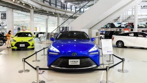 A blue 2021 Toyota Mirai on a showroom floor.