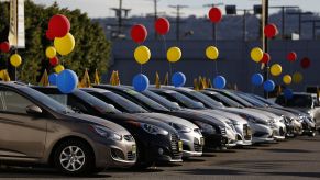 used car dealer with colorful ballons