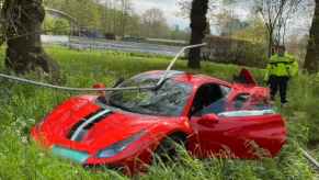 wrecked red Ferrari 488 Pista after crash