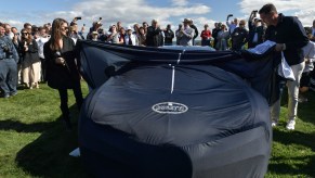 A bugatti chiron under a car cover