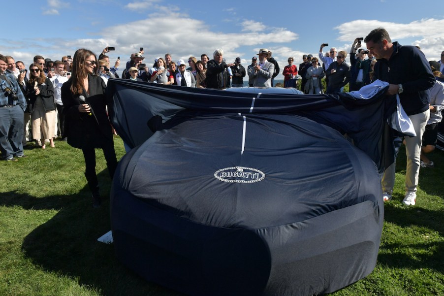 A bugatti chiron under a car cover