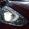 A dull looking headlights of a mitsubishi mirage